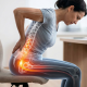 Woman with sciatica at work